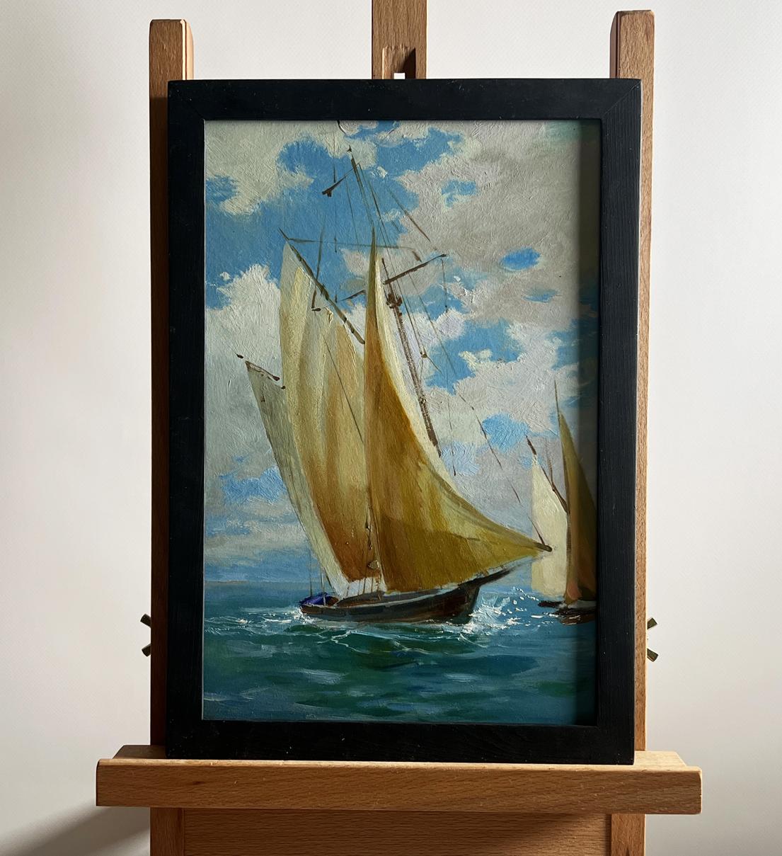 Framed oil painting of sailboats at sea by Yuriy Suprunchuk on wooden easel