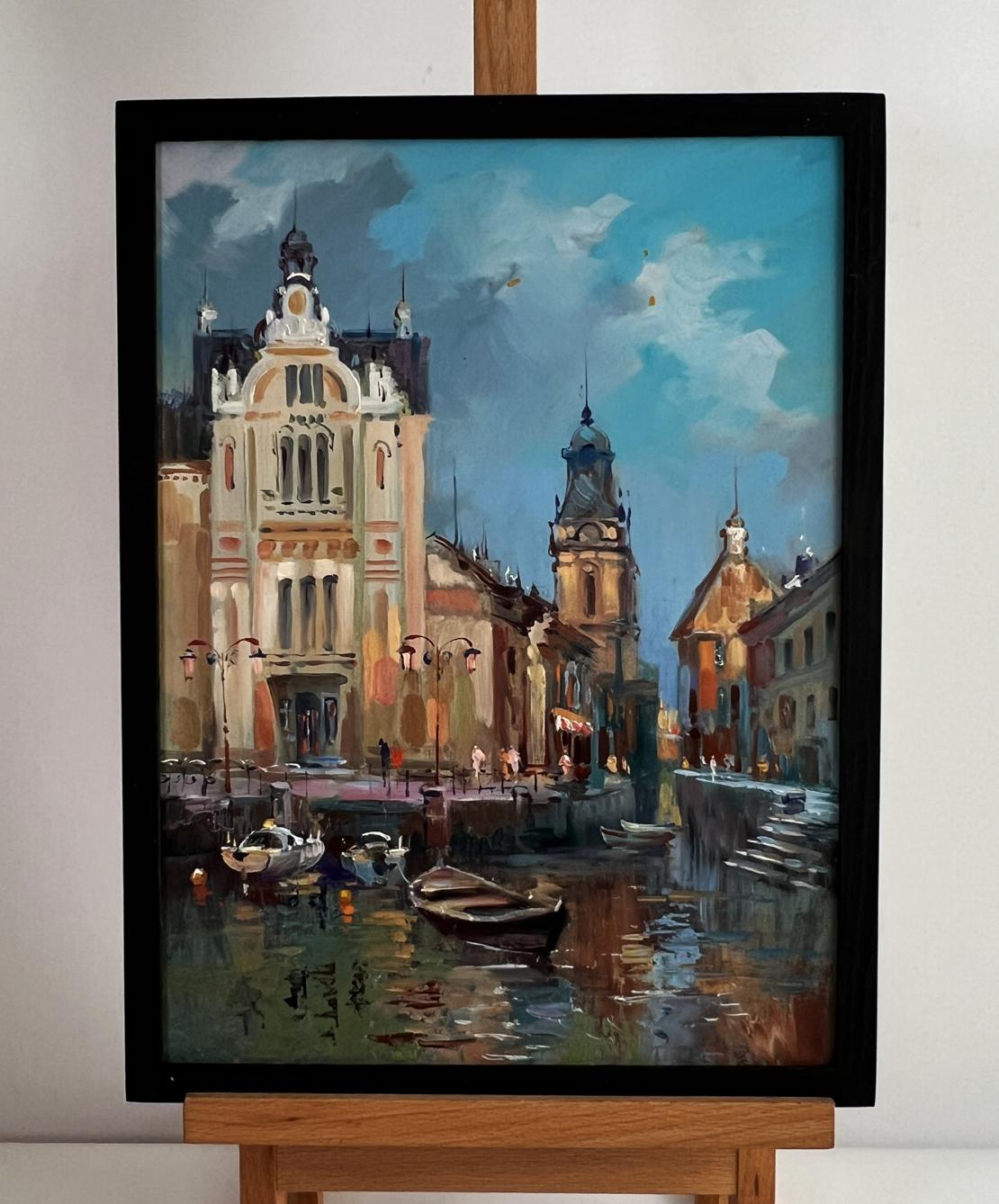 Framed oil painting of European cityscape with river by Yuriy Suprunchuk