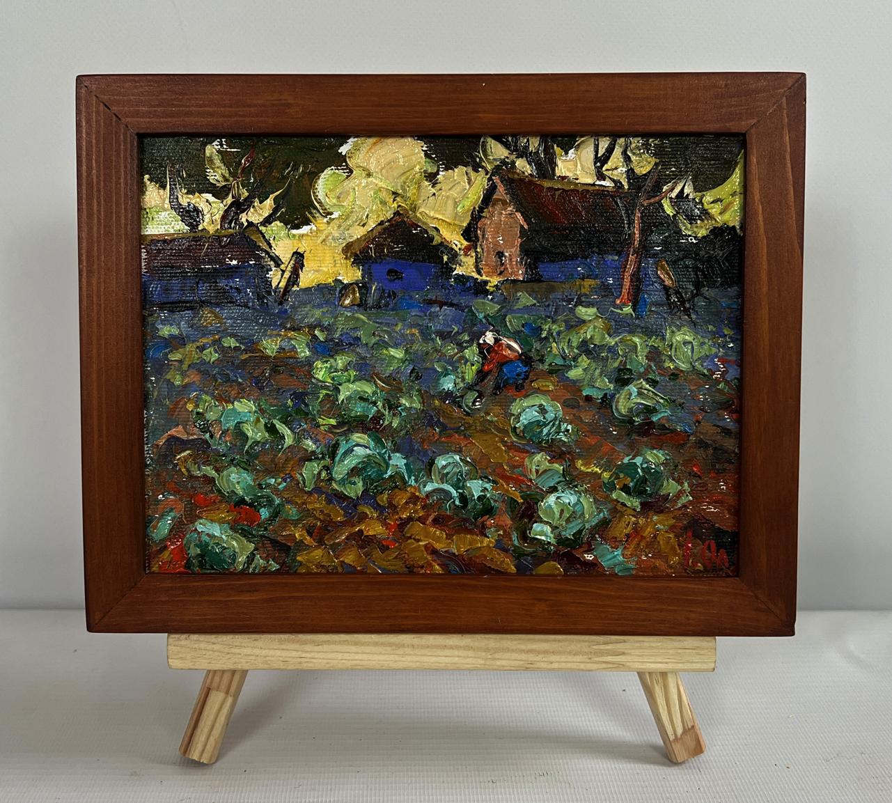 Oil painting by Oleksiy Ivanyuk: Cabbage garden with green cabbages, blue houses, yellow trees