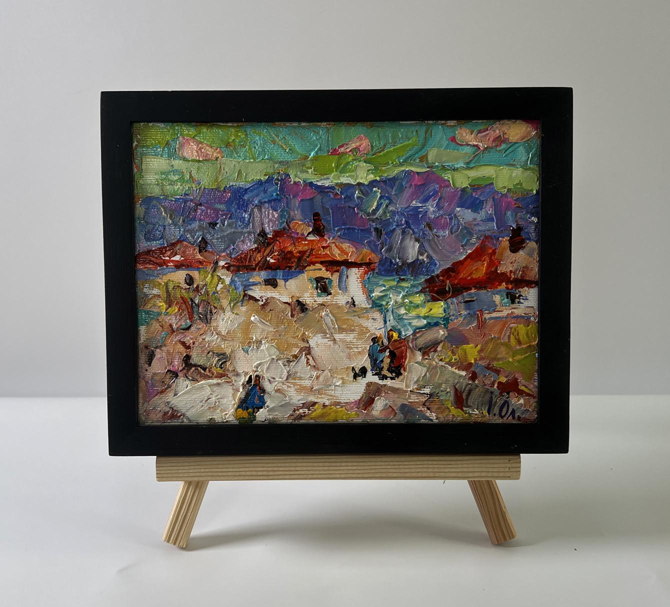 Oil painting Village Memories by Oleksiy Ivanyuk in black frame on easel
