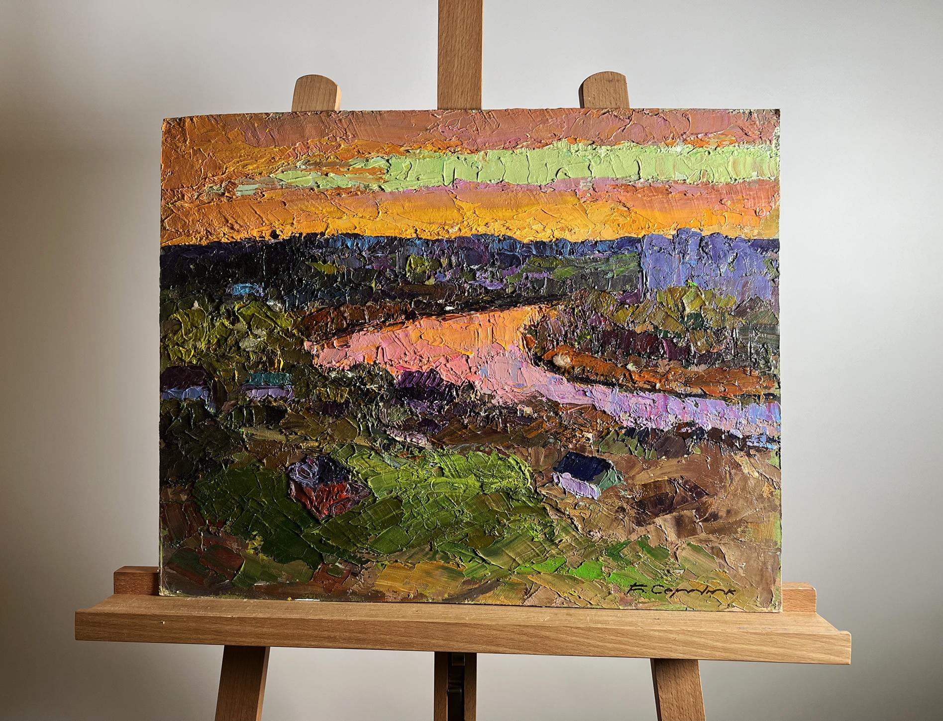 Vibrant oil painting of orange sunset landscape by Boris Serdyuk on easel