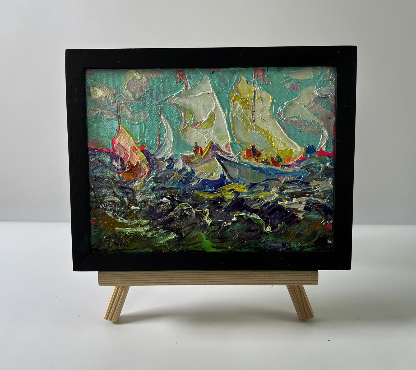 Oil painting of sailboats on turbulent seas by Oleksiy Ivanyuk in black frame