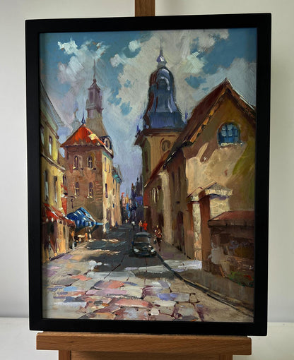 Oil painting Quiet street in old town by Yuriy Suprunchuk in black frame