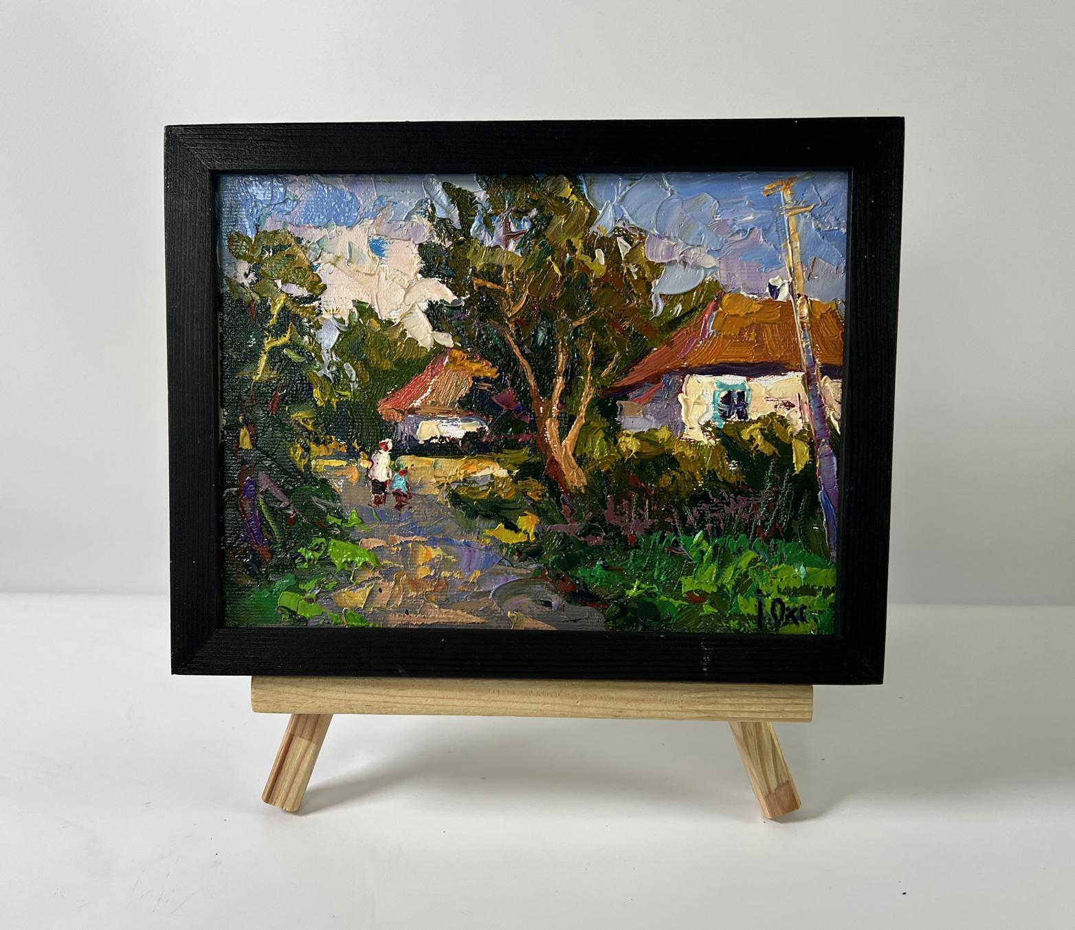 Black-framed Oil painting Street in the village by Oksana Ivanyuk, vibrant rustic scene