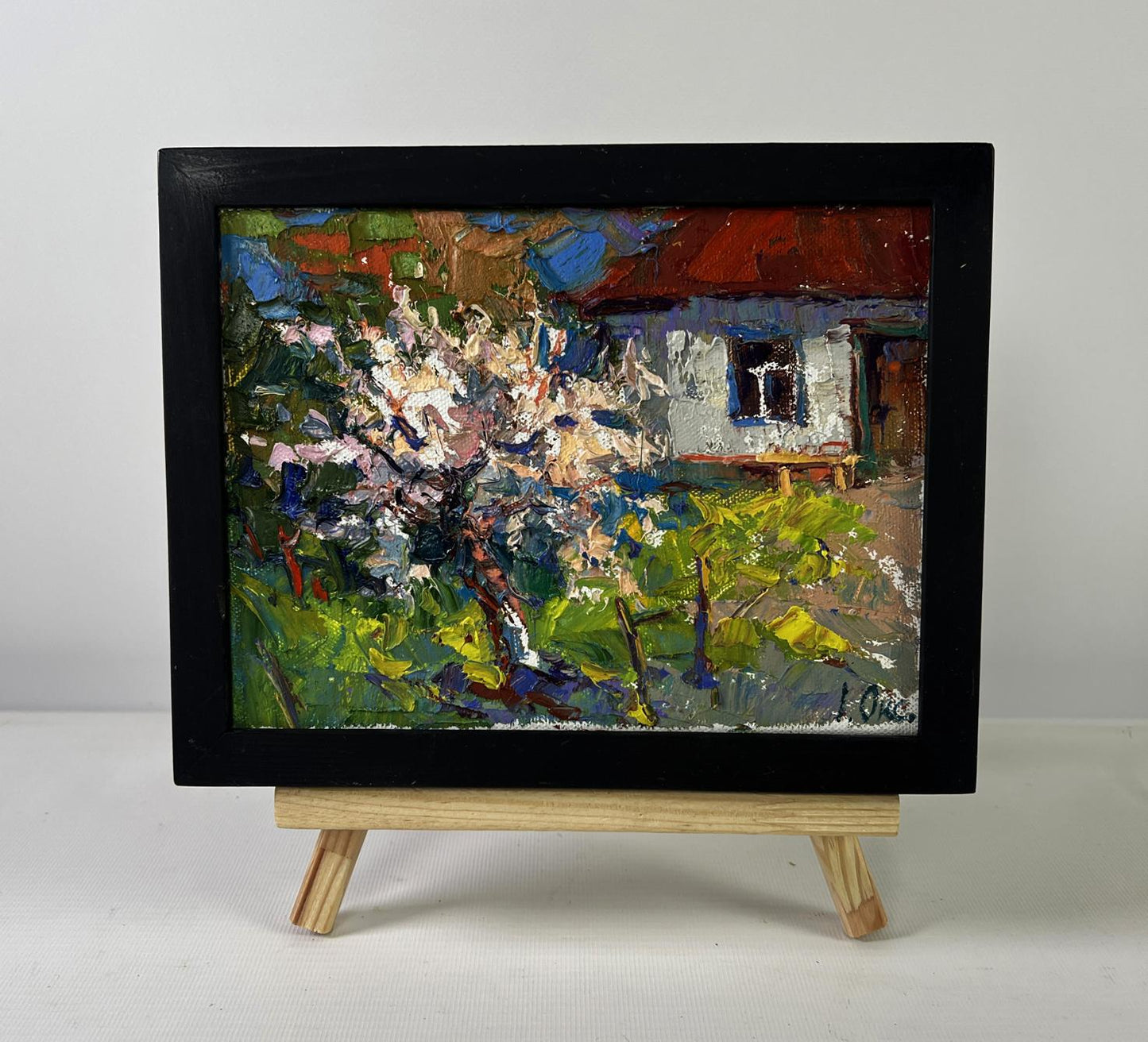 Vibrant impressionist oil painting Petals under the warm spring sun by Oksana Ivanyuk on wooden easel