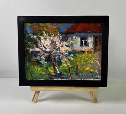 Vibrant impressionist oil painting Petals under the warm spring sun by Oksana Ivanyuk on wooden easel