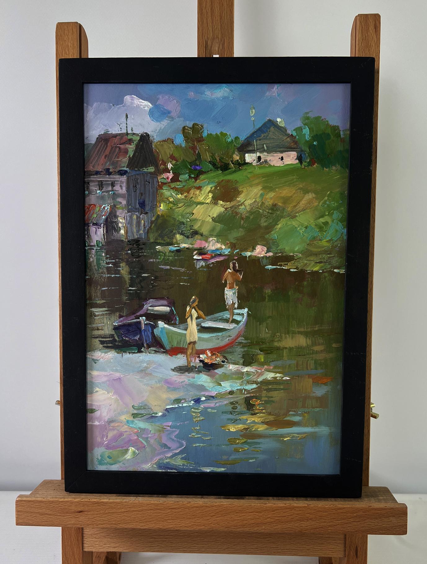 Oil painting of girls sailing in boat by Yuri Suprunchuk in black frame on easel