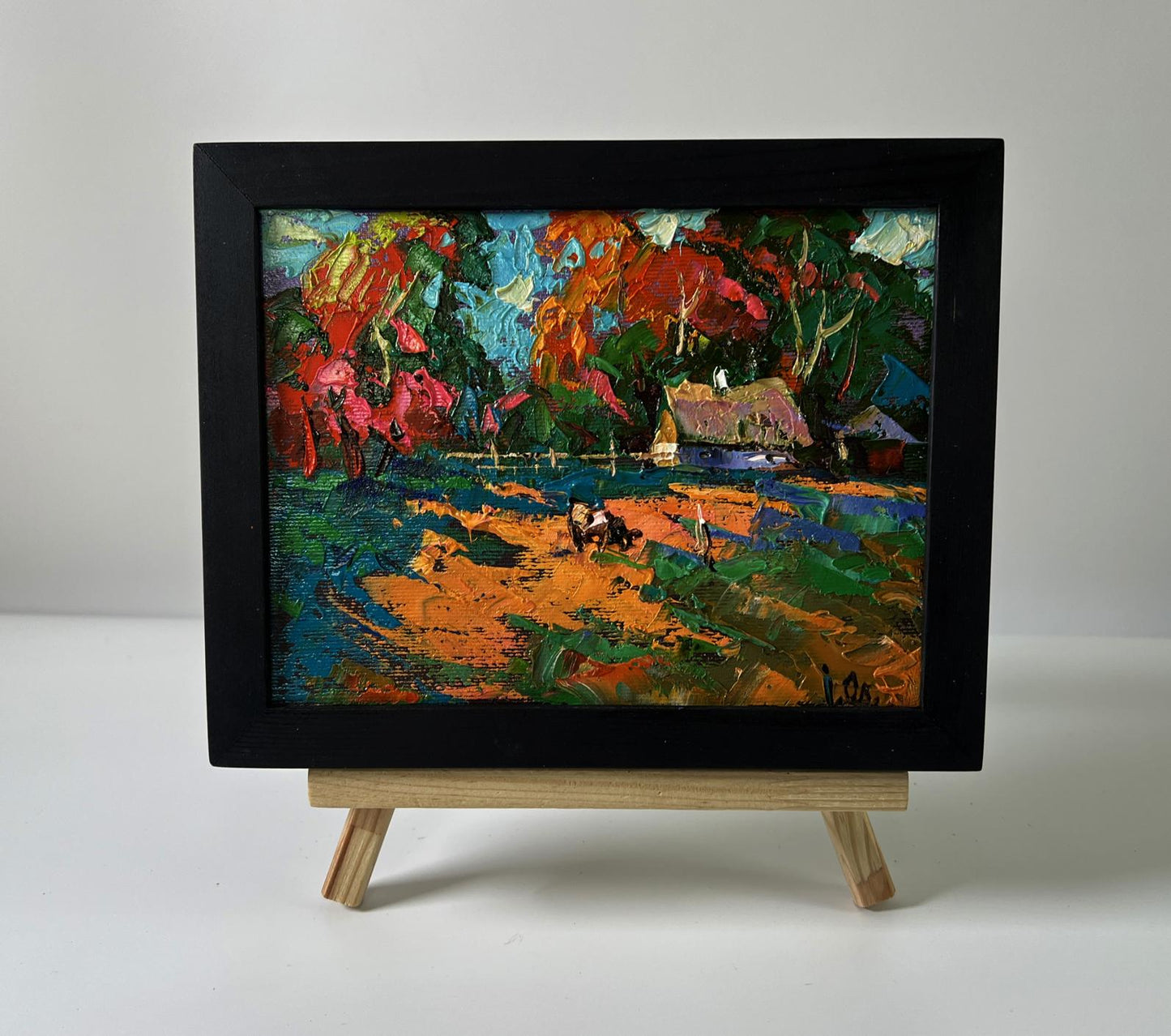 Oil painting Village in the rays of the sun by Oleksiy Ivanyuk in black frame