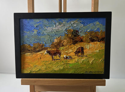Oil painting Cows on the hill by Boris Serdyuk in black frame