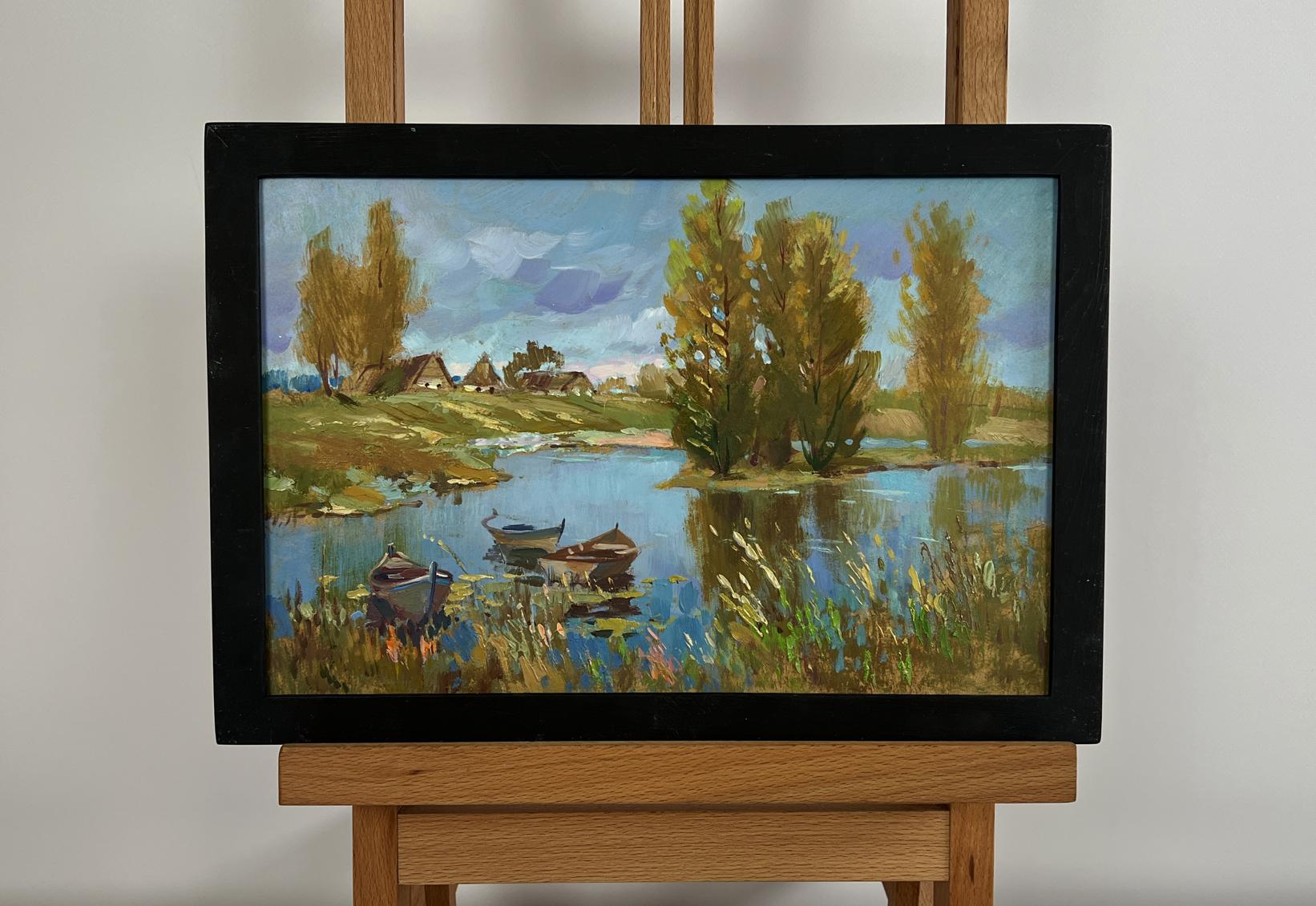 Framed oil painting of serene lakeside by Yuriy Suprunchuk