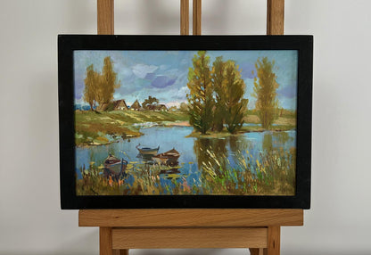 Framed oil painting of serene lakeside by Yuriy Suprunchuk