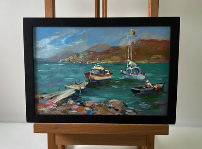 Oil painting of boats on seashore by Yuriy Suprunchuk in black frame