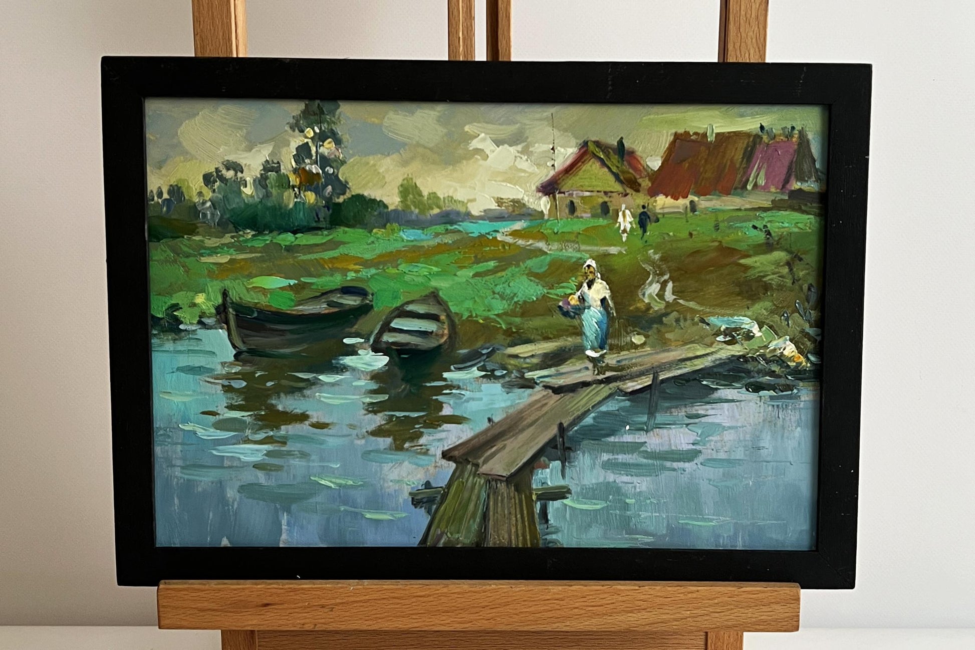 Oil painting of village river with two boats by Yuriy Suprunchuk