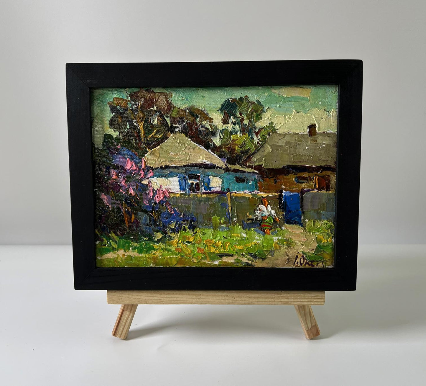 Oil painting Warm day in the village by Oksana Ivanyuk on wooden easel