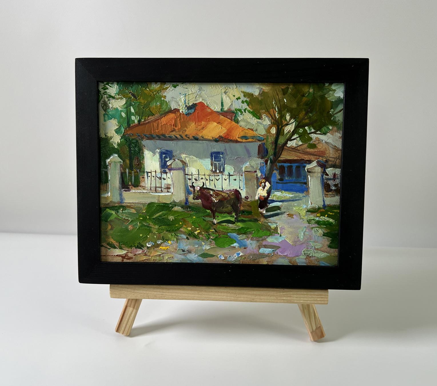 Oil painting by Yuriy Suprunchuk: cow near orange-roofed rustic house