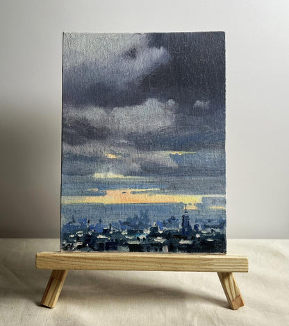 Oil painting Yellow sunset over the city by Tatyana Derdey moody cityscape