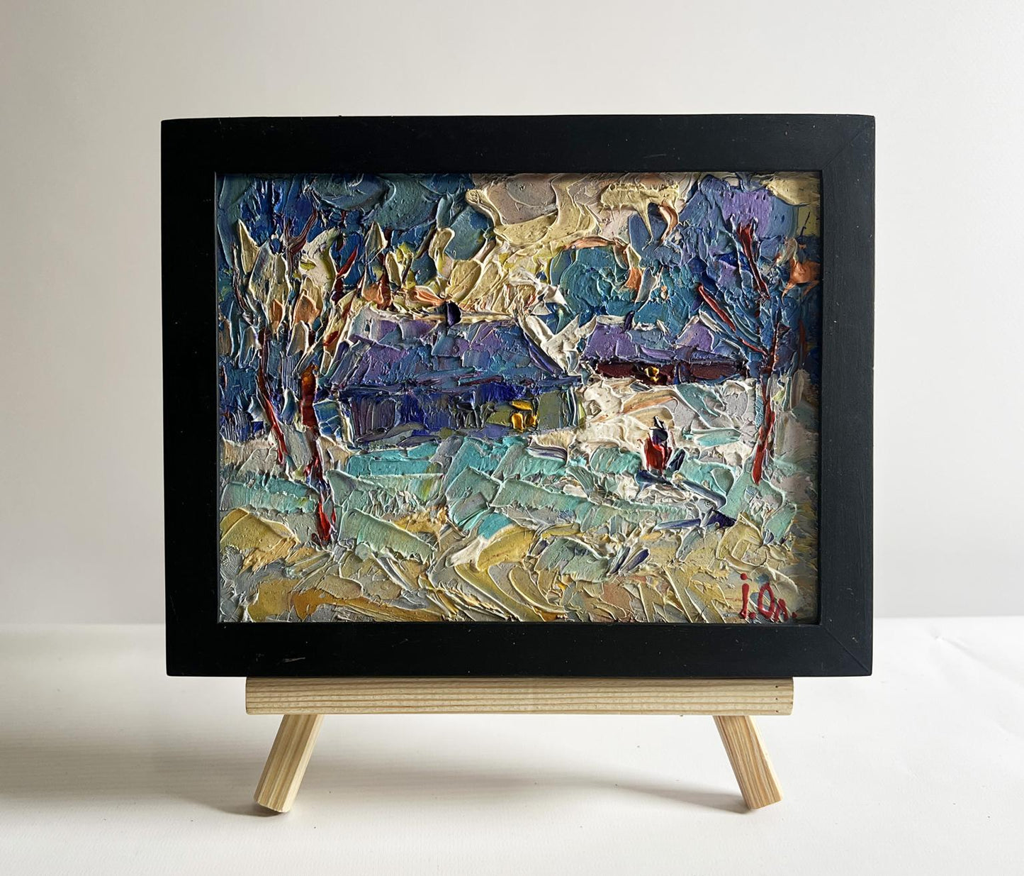 Oil painting Evening on the edge of the village by Oleksiy Ivanyuk, textured winter landscape in black frame