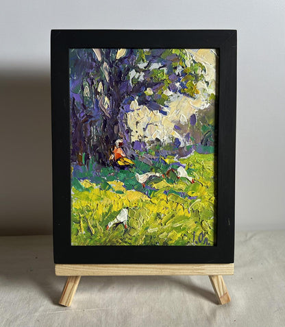 Oil painting Relaxing in the meadow by Oleksiy Ivanyuk in black frame