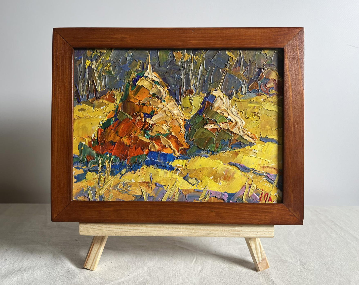 Oil painting In a sunny field by Oleksiy Ivanyuk in brown frame