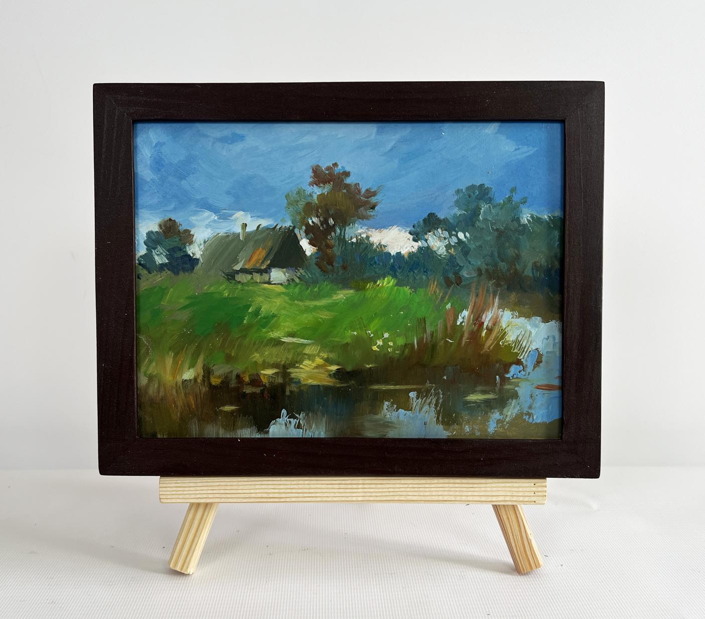 Oil painting A lonely house by the river by Yuriy Suprunchuk in dark frame