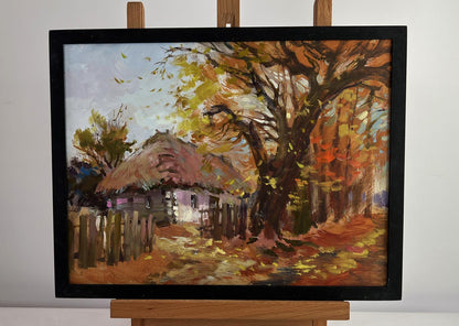 Oil painting of street in golden leaves by Yuriy Suprunchuk in black frame