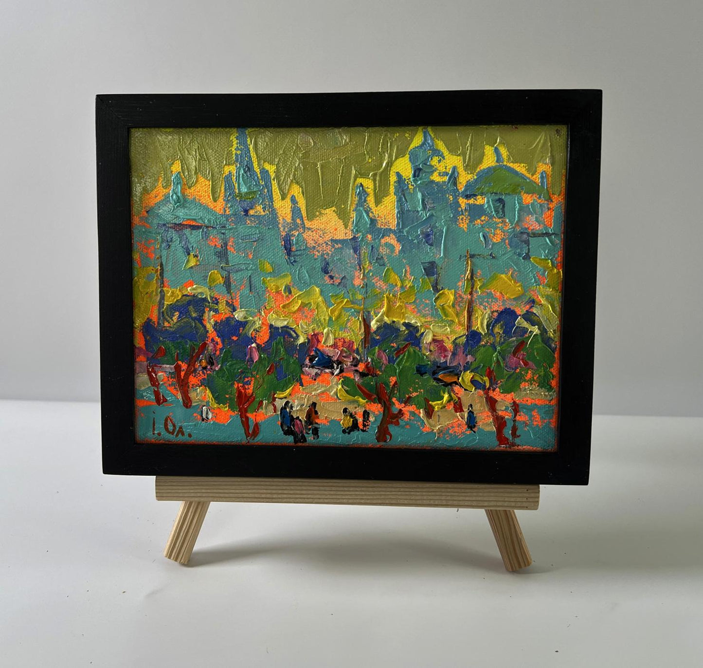 Oil painting City in the rays of sunset by Oleksiy Ivanyuk in black frame