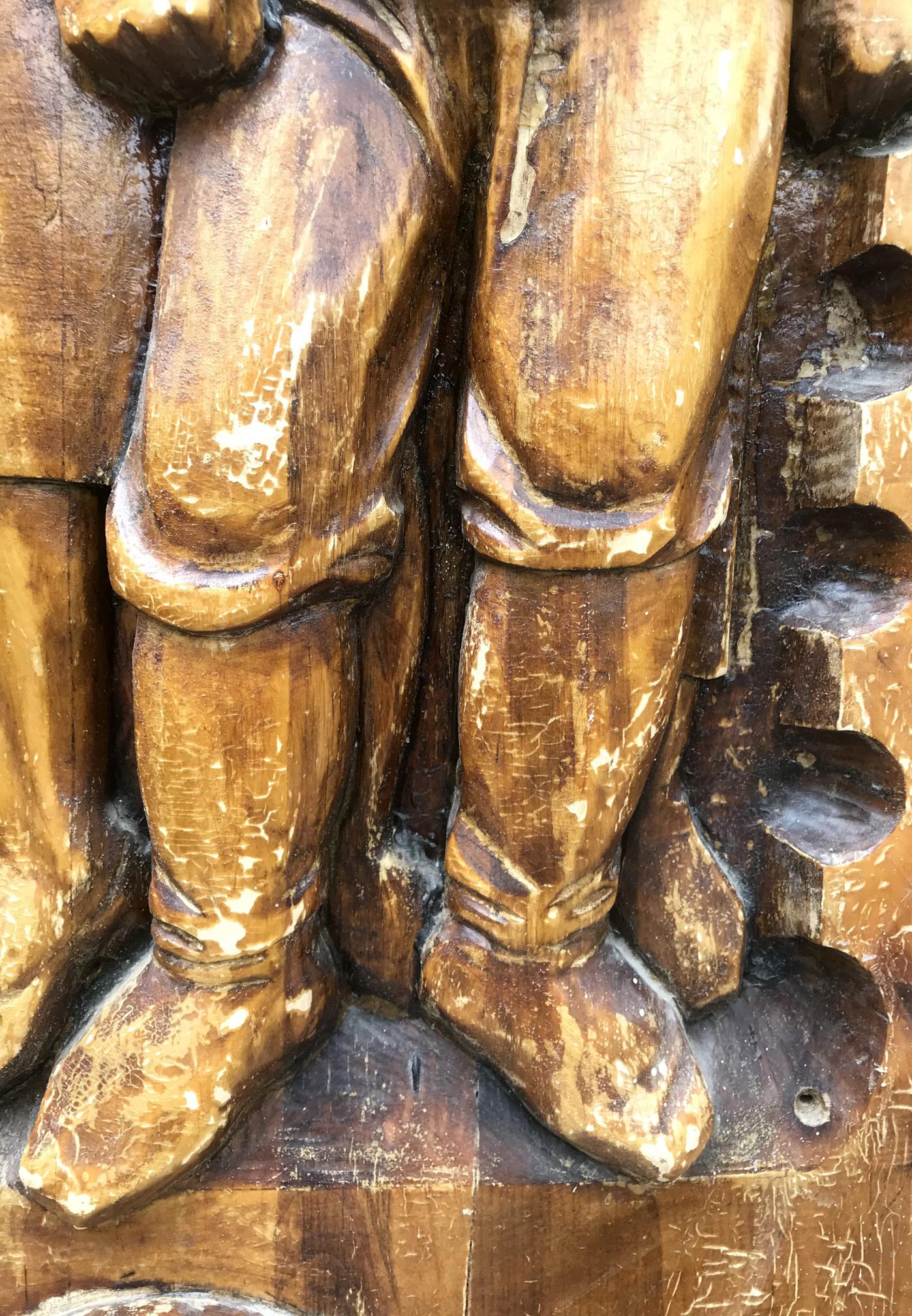Carved wooden medieval knight legs in social realism style, weathered brown grain