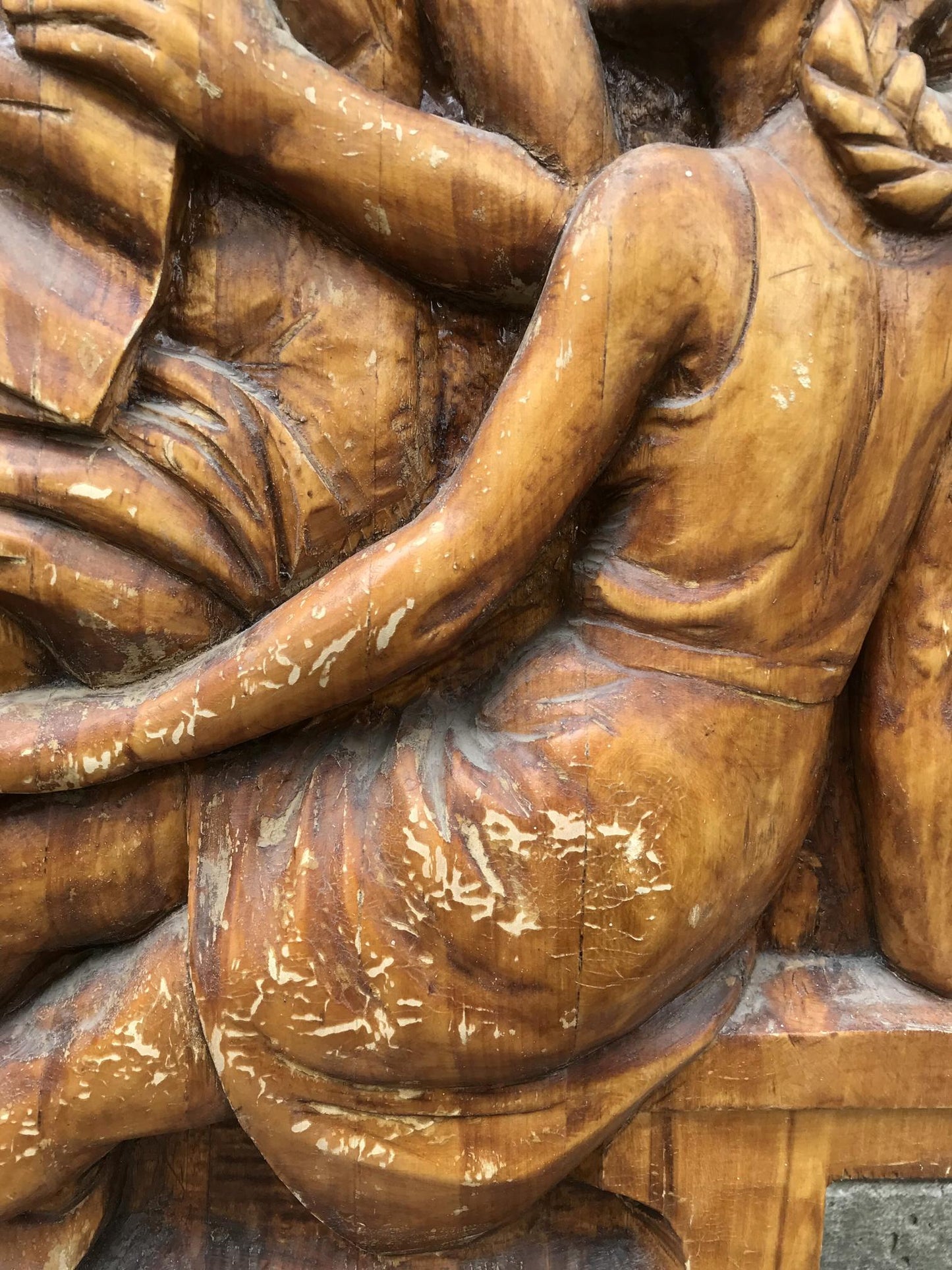 Detailed wooden carving of Social realism figure in flowing garment