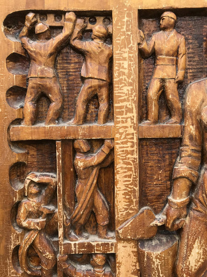 Social realism carved wooden relief of laboring workers, warm brown weathered finish