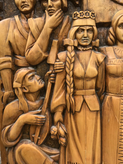 Carved wooden relief of USSR peoples friendship with central crowned woman