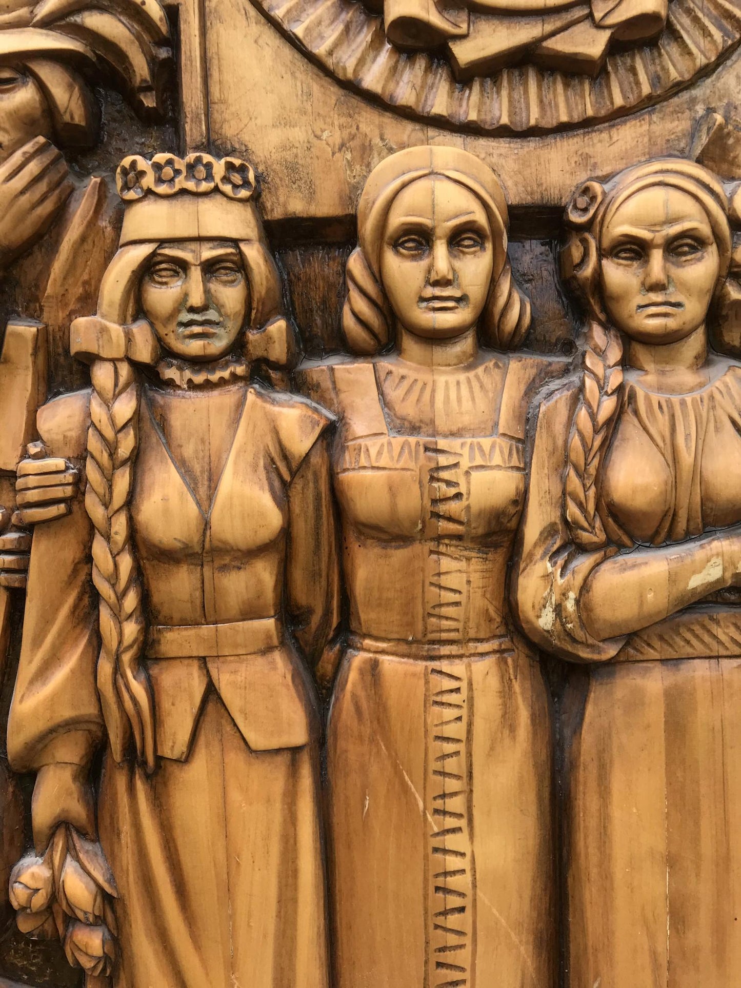 Carved wooden relief of USSR peoples friendship: 3 women in traditional attire