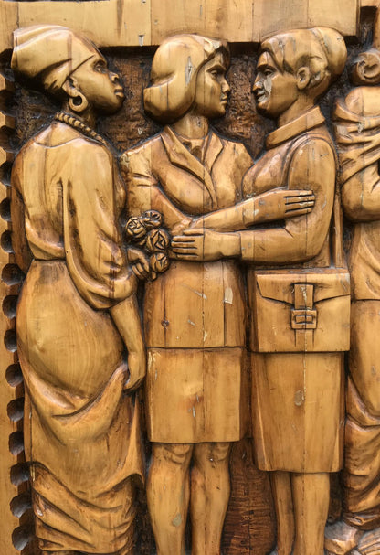 Detailed wooden relief of three women in period attire, social realism fraternal solidarity sculpture
