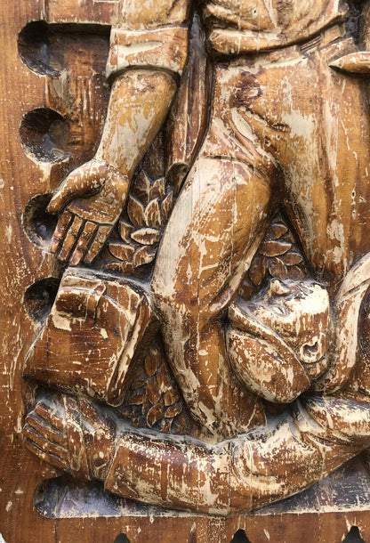 Weathered wooden relief in social realism style, rustic brown figure
