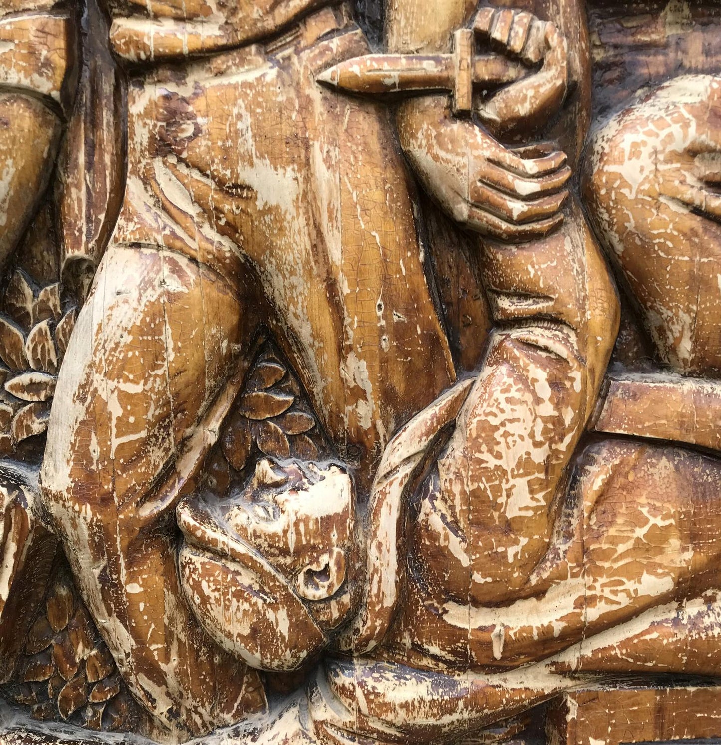 Weathered wooden warrior relief in social realism style, brown tones