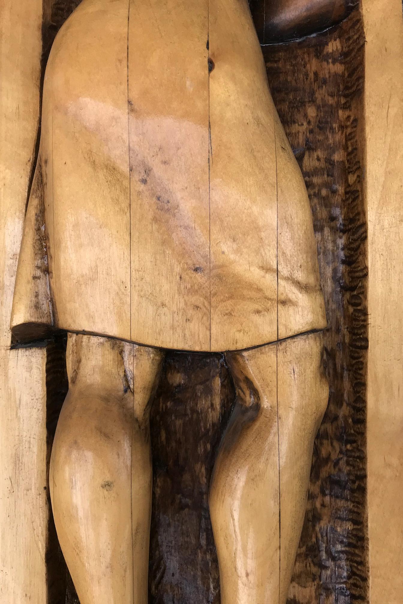 Hand-carved wooden social realism sculpture on nature protection law