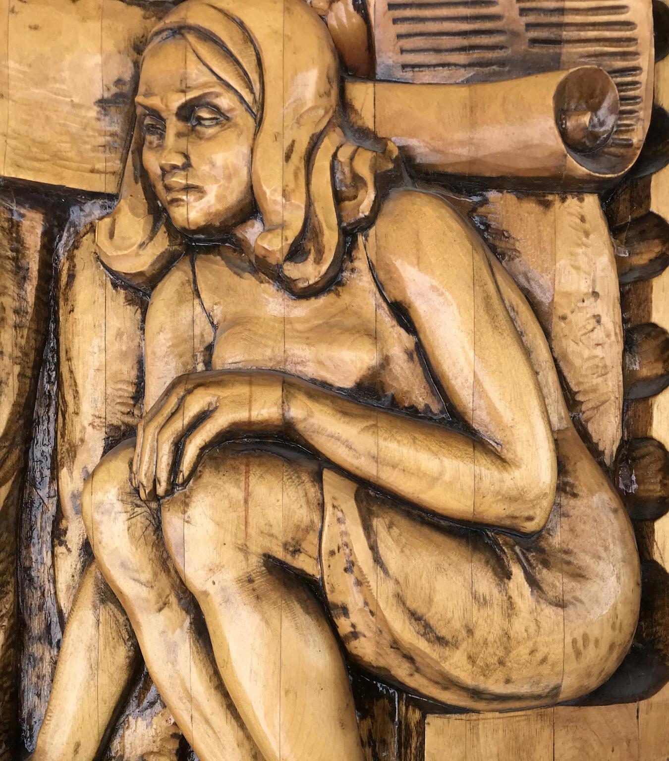 Detailed wood-carved nude woman sculpture from Social realism Law on Architectural Monuments
