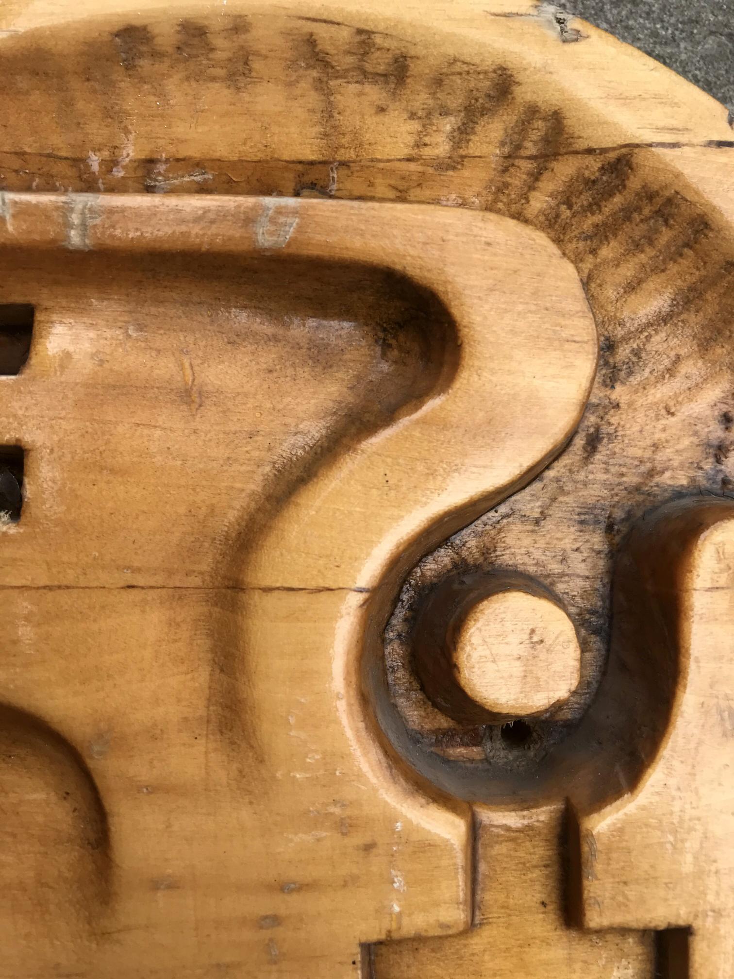 Weathered light brown wooden puzzle piece for Social realism Dove of peace