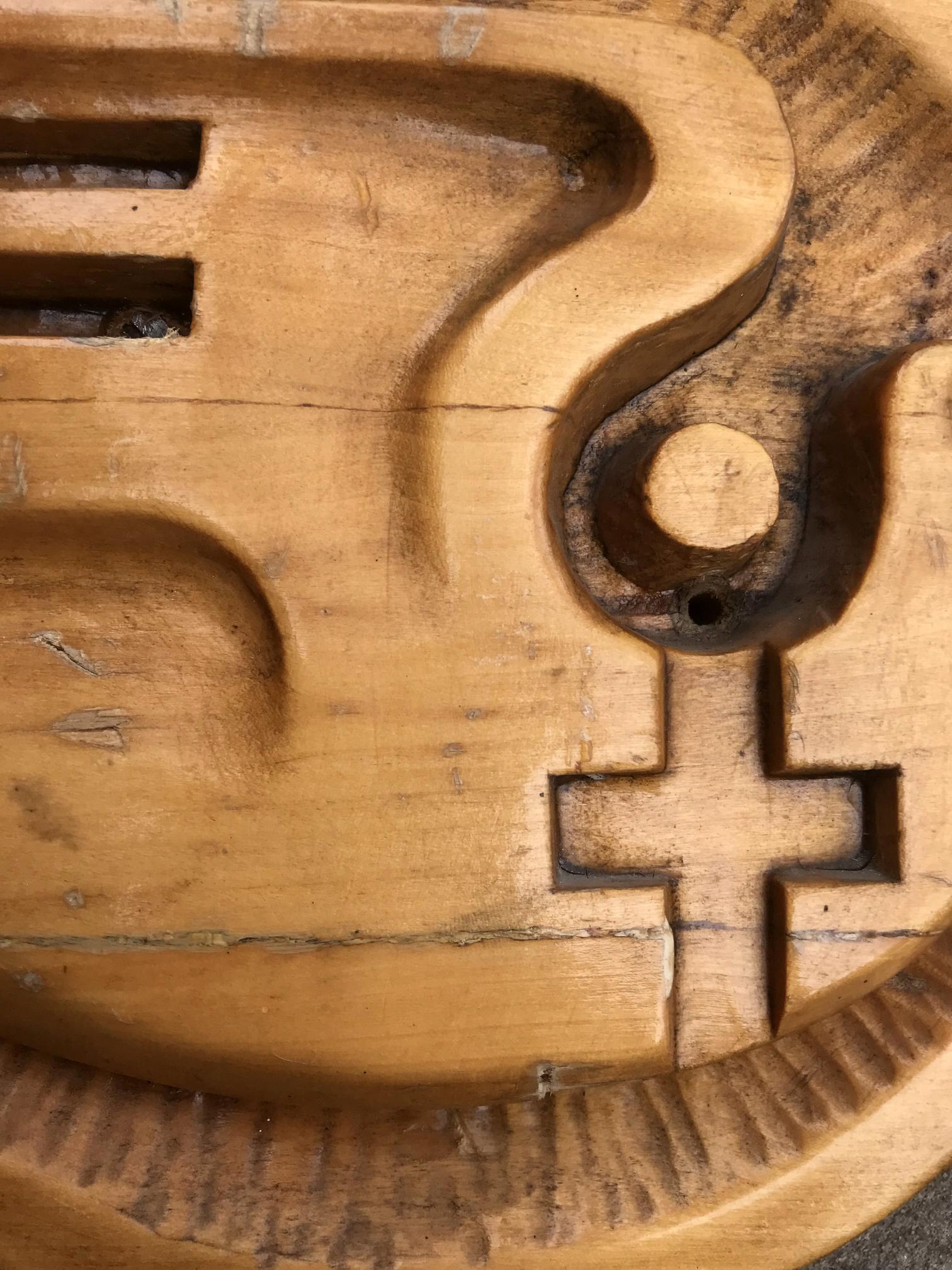 Weathered wooden Social realism Dove of peace maze game with carved paths