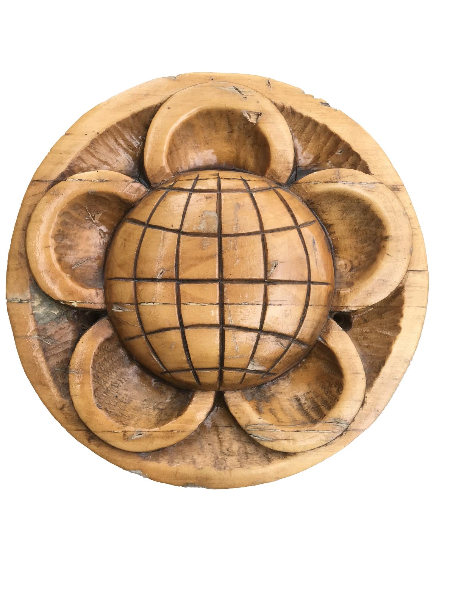Hand-carved wooden bowl with globe and petal design