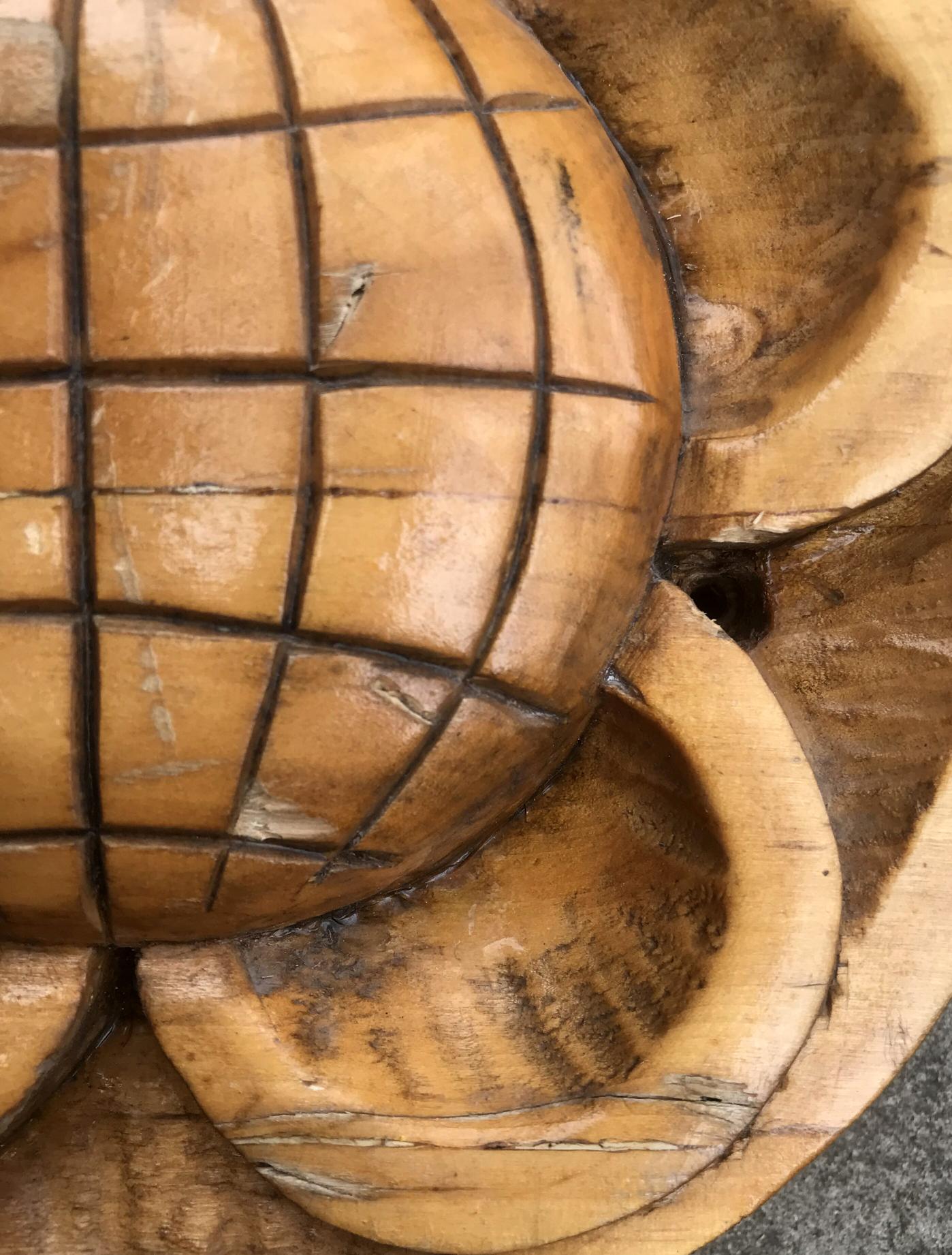 Hand-carved wooden bowl with grid pattern and natural grain finish