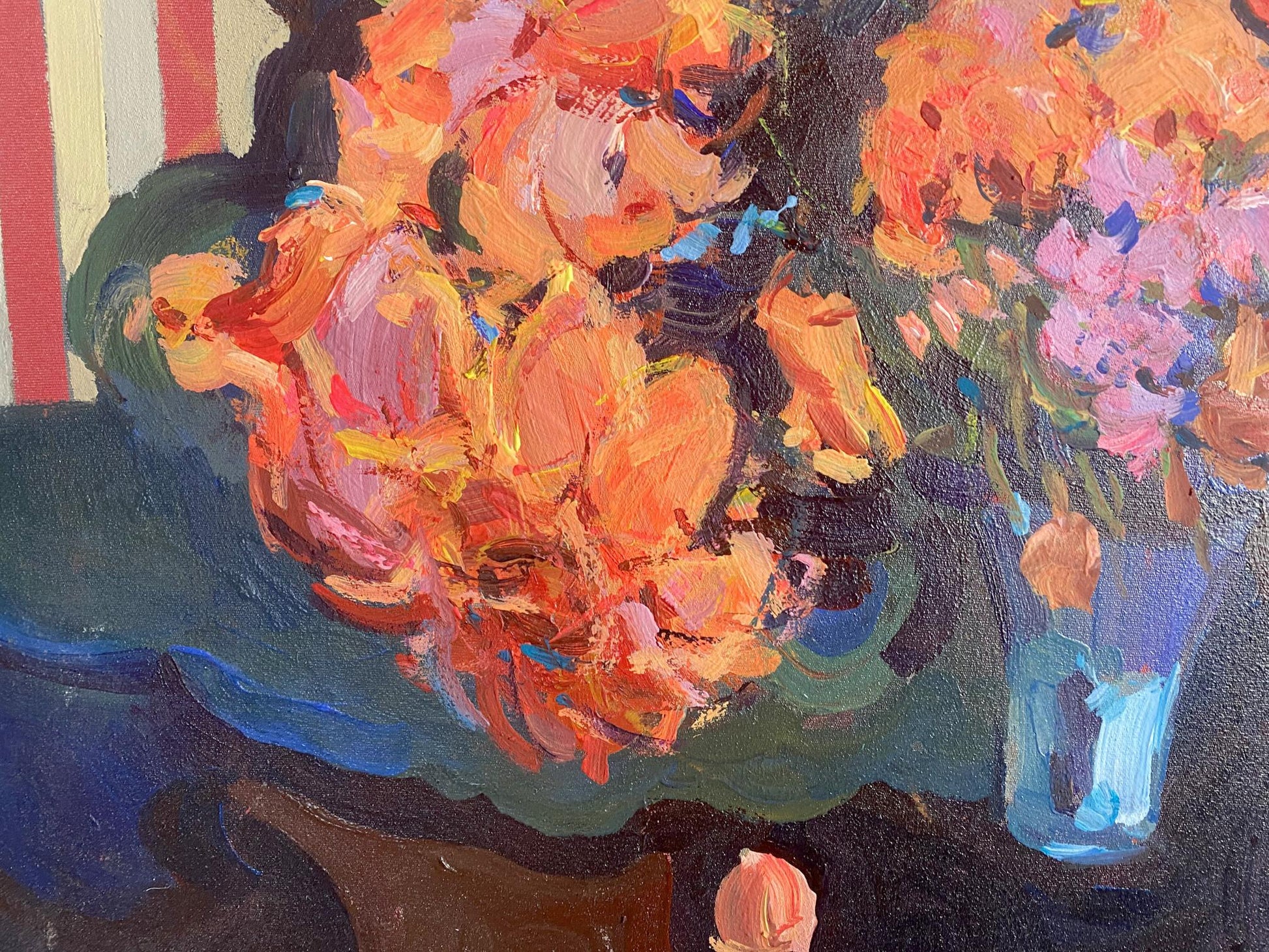 Oil painting Evening still life by Samchuk Vasily Alexandrovich: vibrant orange and pink blossoms in translucent blue glass vase
