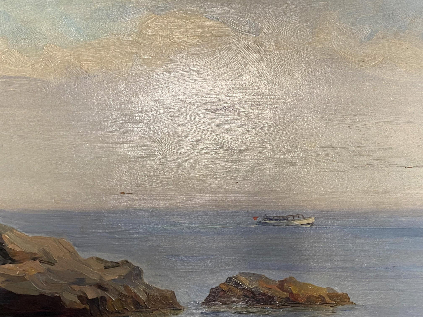 Oil painting by Strelov Arkady Efimovich: small white boat with red flag on rocky coast