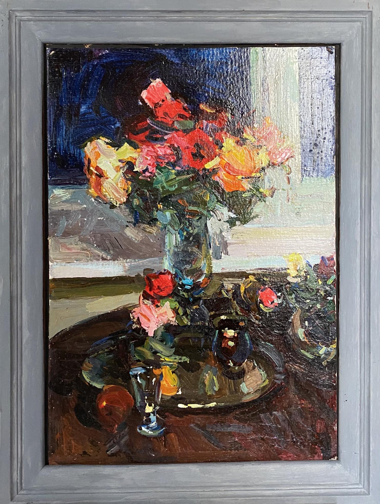 Oil painting by Ryman Evgeny Nikolaevich: vase with red, orange, pink roses in gray frame