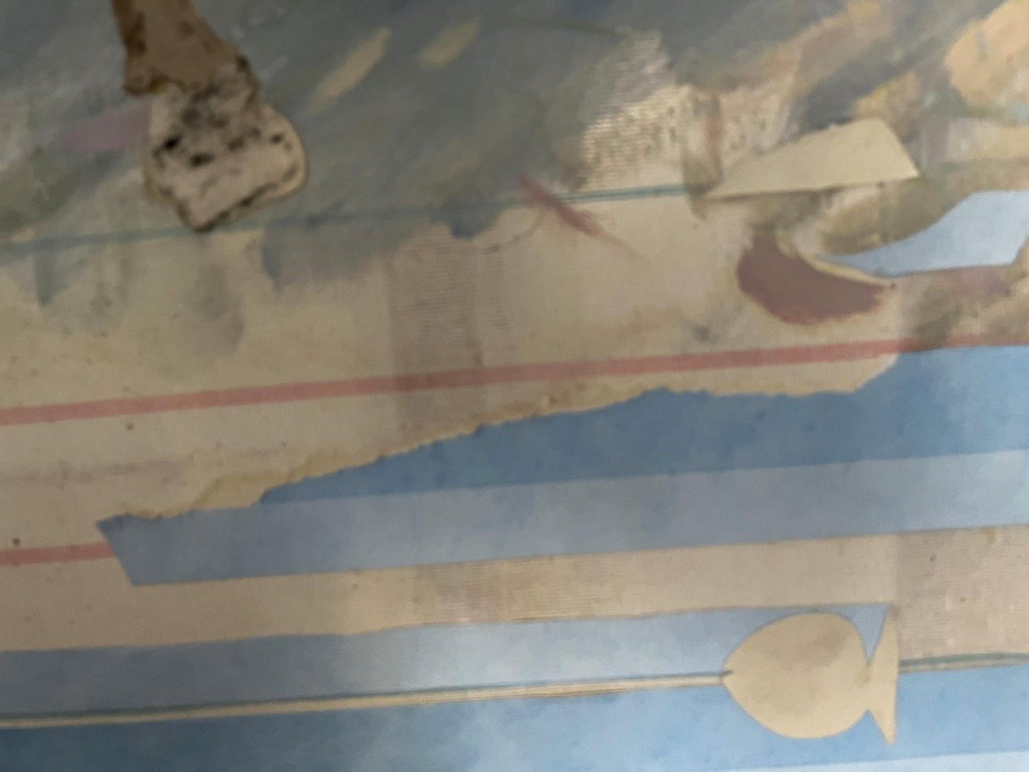 Peeling blue white striped wallpaper with faded fish in Barabash sea painting