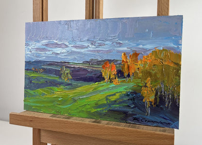 Vibrant impressionist oil painting by Boris Serdyuk: green fields, golden autumn trees, blue sky