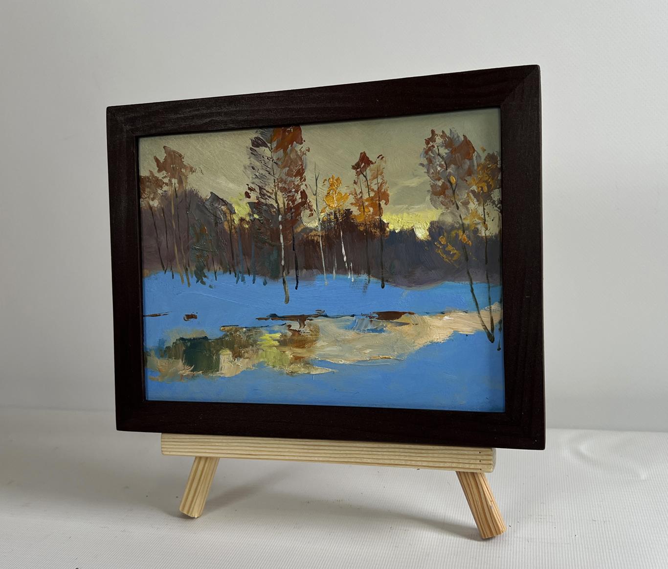 Framed oil painting of winter landscape with yellow sunset reflection by Yuriy Suprunchuk