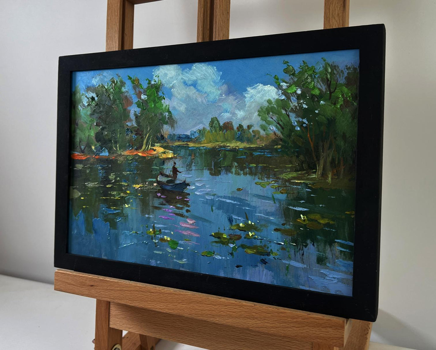 Framed oil painting of serene lakeside by Yuriy Suprunchuk