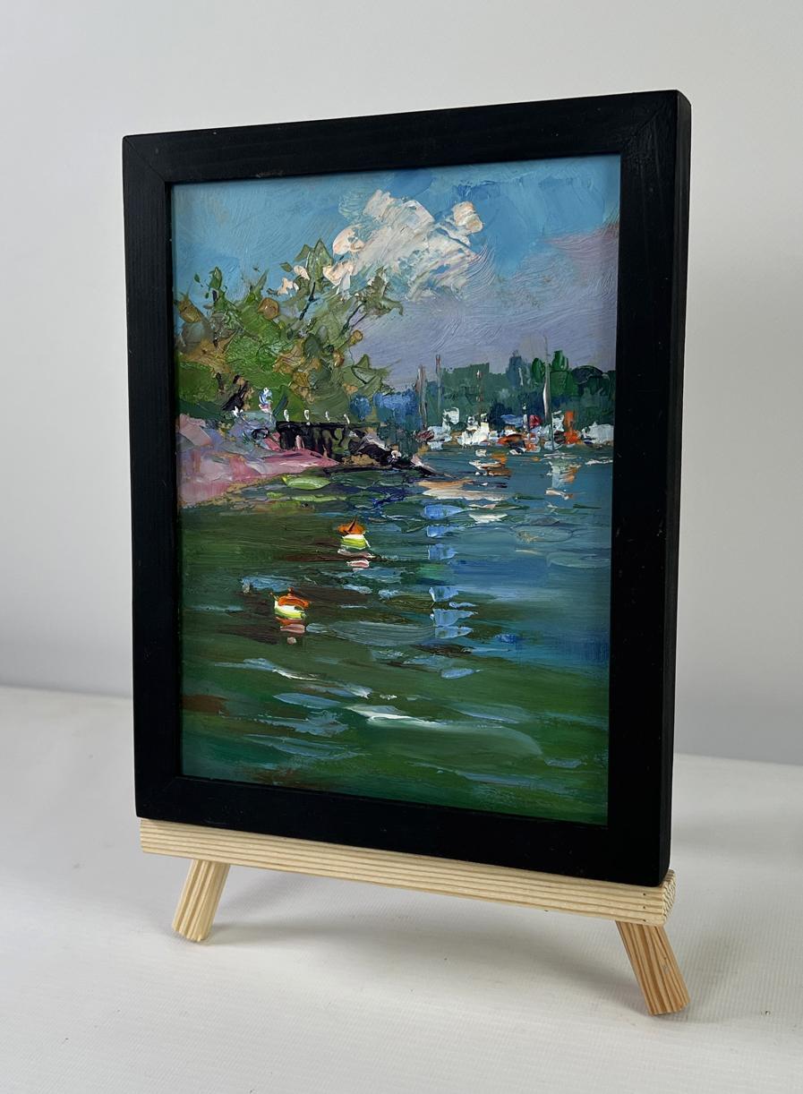 Miniature black-framed impressionist lakeside ducks painting on easel by Yuriy Suprunchuk