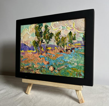 Oil painting In the autumn meadows by Oleksiy Ivanyuk in black frame