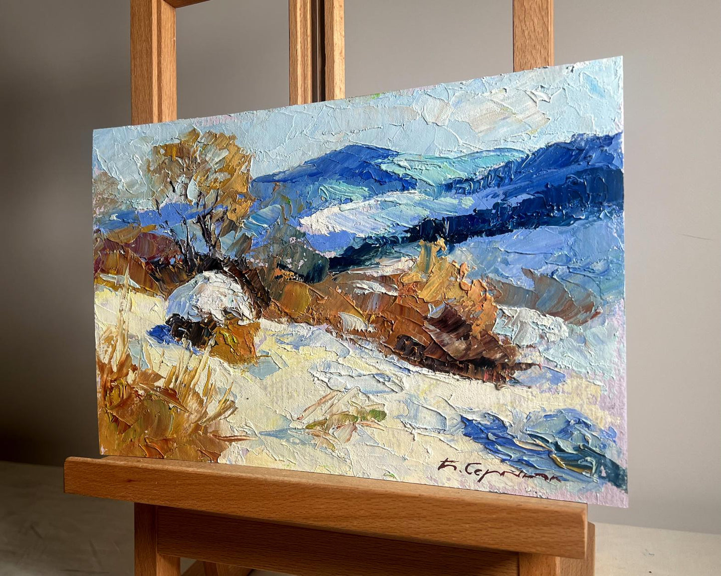 Oil painting Winter mountains by Boris Serdyuk with snow hills and autumn trees